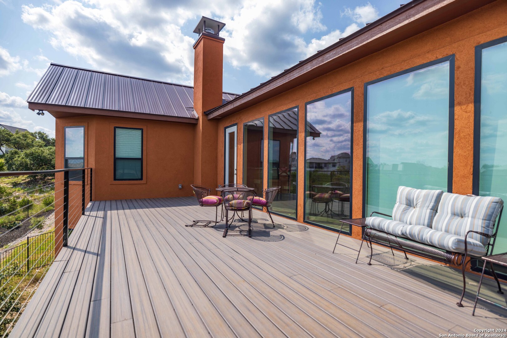 86 Hannah Lane Boerne, TX 78006 - Photo 10 of 45 a balcony with furniture and wooden floor