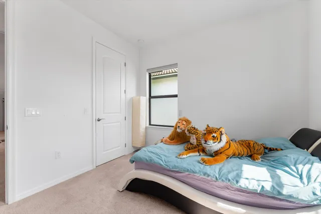 a room with a bed and a window