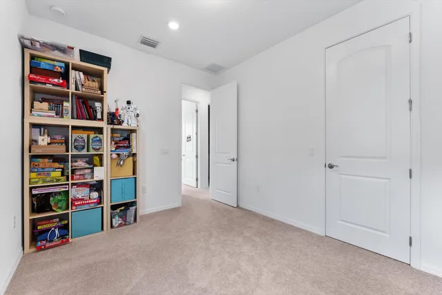 a view of an empty room with shelves