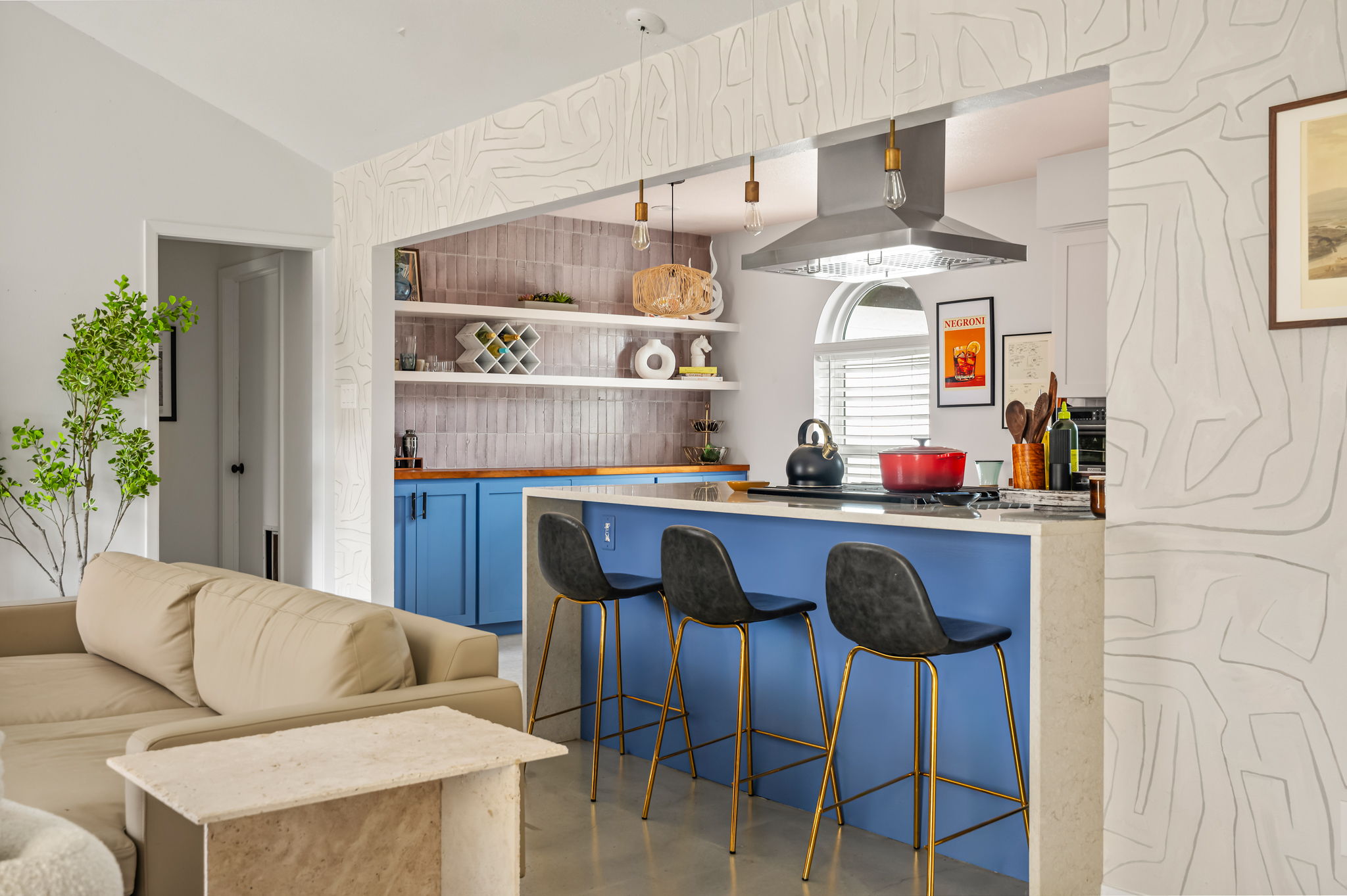 9300 Meadow Vale Austin, TX 78758 - Photo 12 of 37 Kitchen featuring a breakfast bar, concrete floors, open shelves, lofted ceiling, and blue cabinets