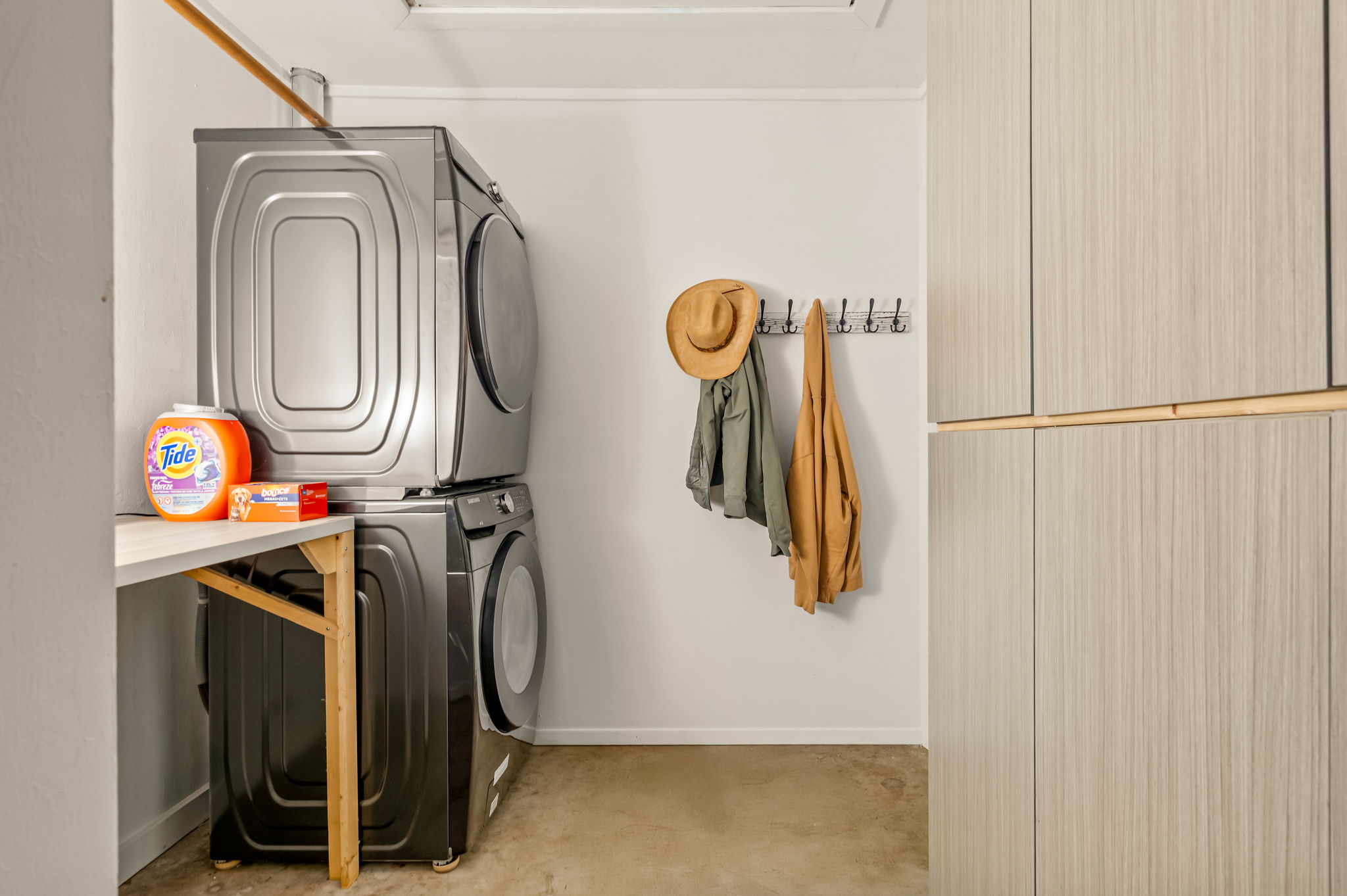 9300 Meadow Vale Austin, TX 78758 - Photo 31 of 37 Laundry area featuring stacked washer and clothes dryer and storage