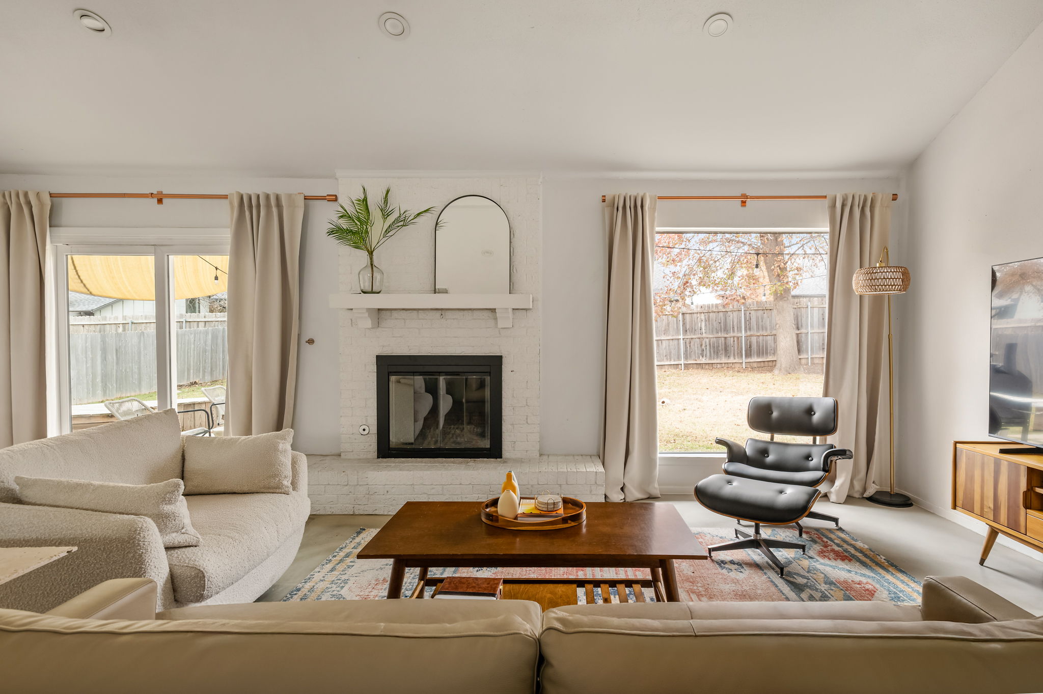9300 Meadow Vale Austin, TX 78758 - Photo 9 of 37 Living area featuring a brick fireplace and healthy amount of natural light