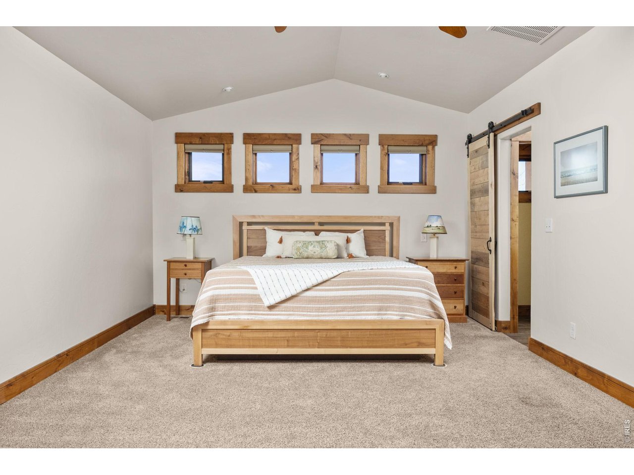 621 Wood Street Fort Collins, CO 80521 - Photo 14 of 50 a bedroom with a large bed and a painting on the wall