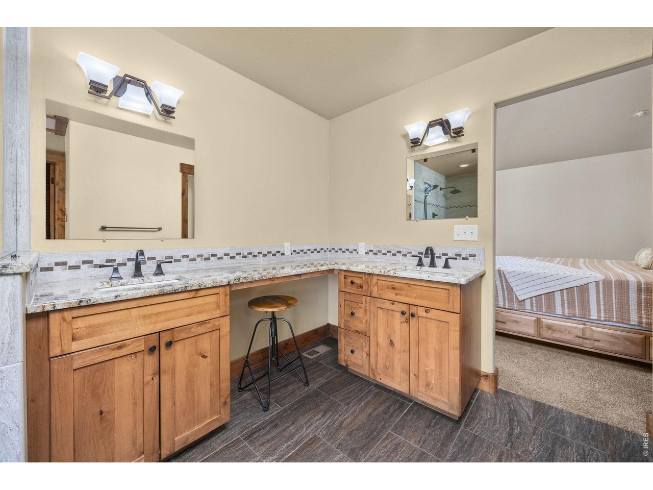 621 Wood Street Fort Collins, CO 80521 - Photo 18 of 50 a bathroom with a granite countertop double vanity sink and a mirror