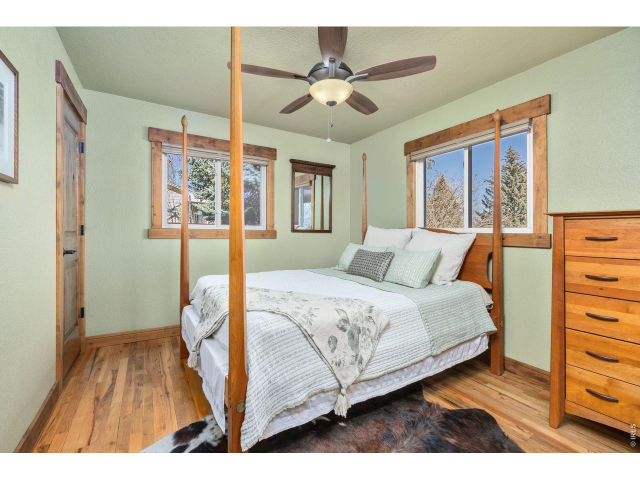 621 Wood Street Fort Collins, CO 80521 - Photo 20 of 50 a bedroom with a bed and a table