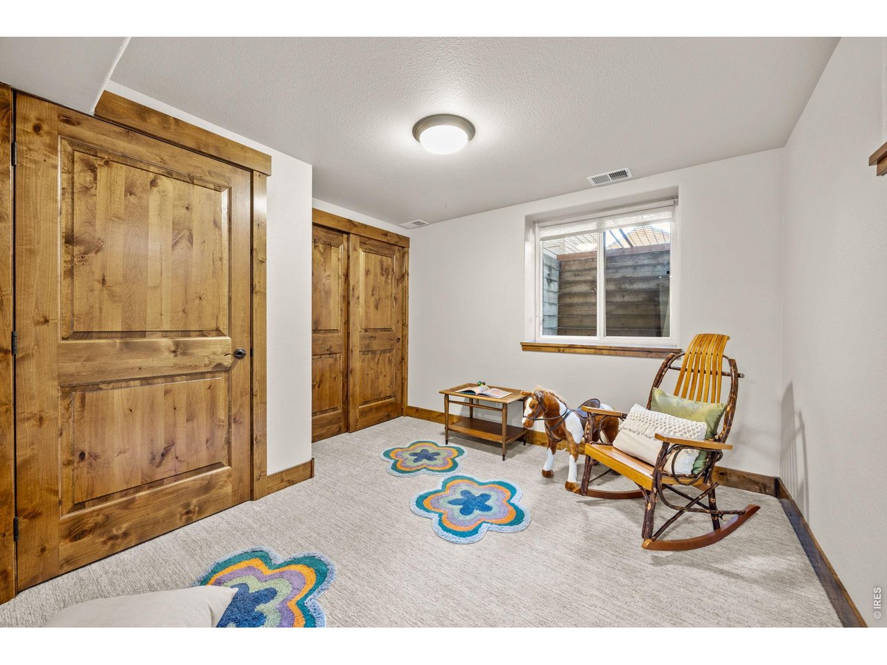621 Wood Street Fort Collins, CO 80521 - Photo 37 of 50 a living room with furniture and a window