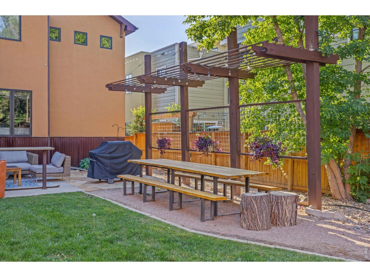 621 Wood Street Fort Collins, CO 80521 - Photo 39 of 50 a view of a chairs and table in the back yard of the house