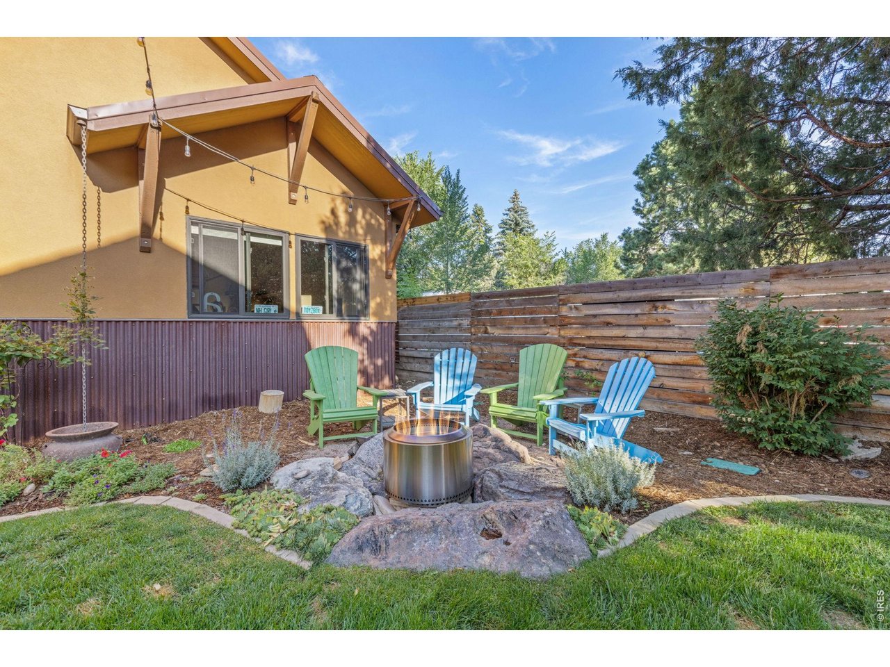 621 Wood Street Fort Collins, CO 80521 - Photo 42 of 50 a view of a chair and table in the backyard