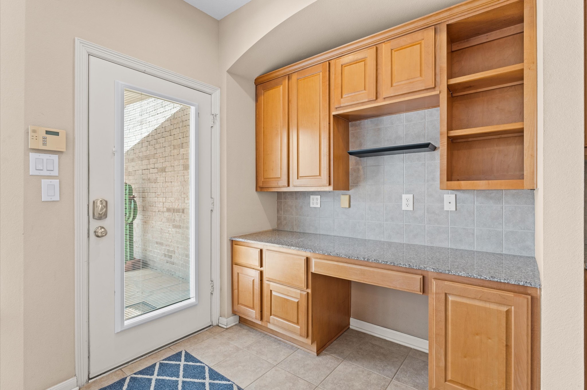 2411 Clippers Square Houston, TX 77058 - Photo 14 of 25 a kitchen with stainless steel appliances granite countertop a refrigerator and cabinets
