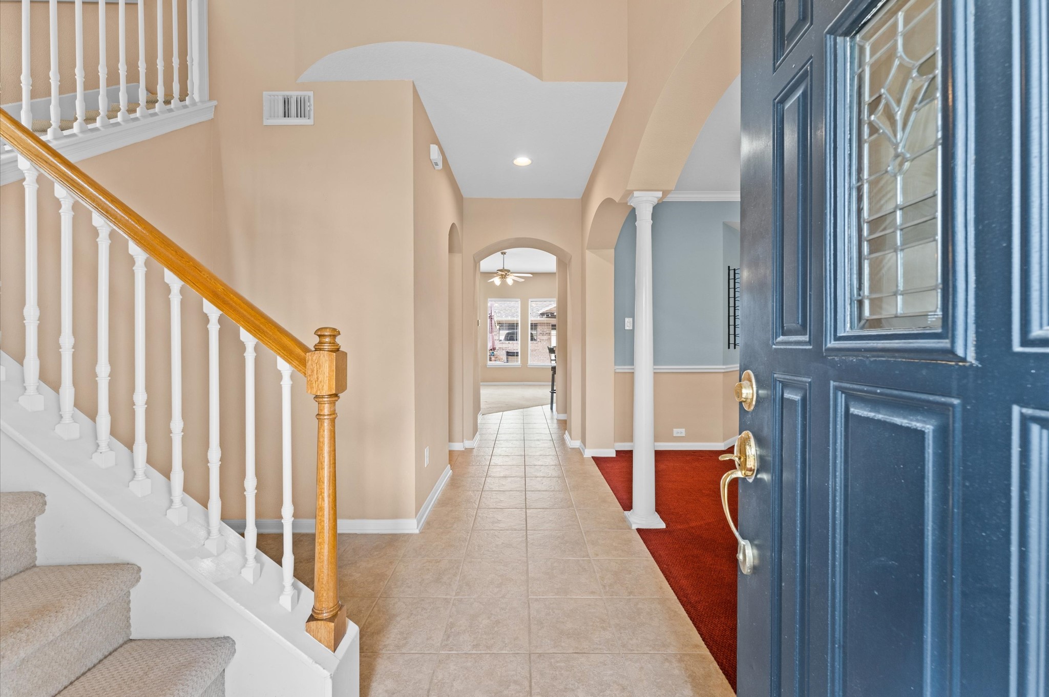 2411 Clippers Square Houston, TX 77058 - Photo 3 of 25 a view of a hallway with wooden floor and staircase