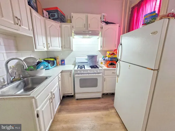 a kitchen with a refrigerator a sink and dishwasher