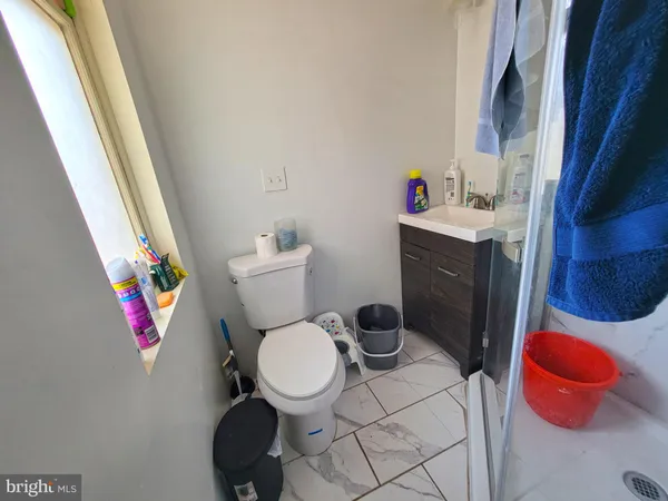 a bathroom with a toilet and a sink