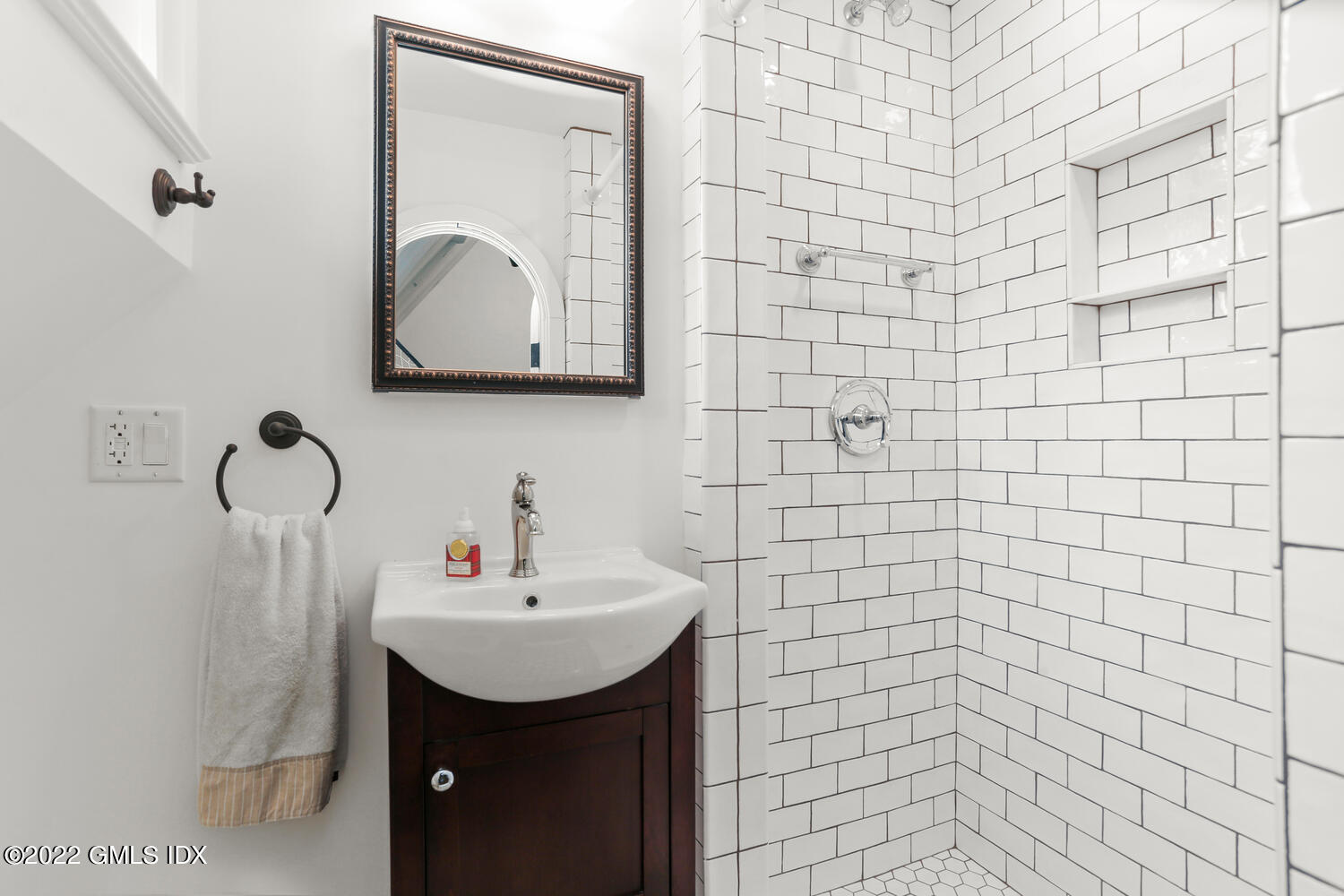 84 Meadow Road Riverside, CT 06878 - Photo 16 of 35 a bathroom with a sink and mirror