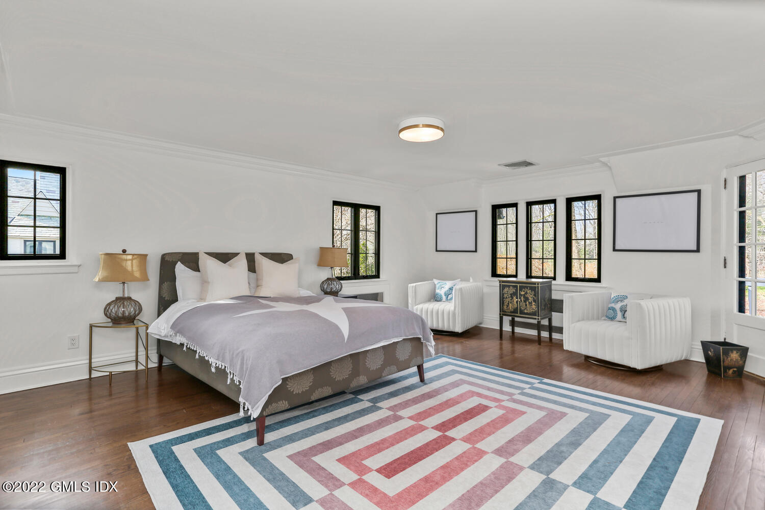 84 Meadow Road Riverside, CT 06878 - Photo 18 of 35 a spacious bedroom with a bed and couch