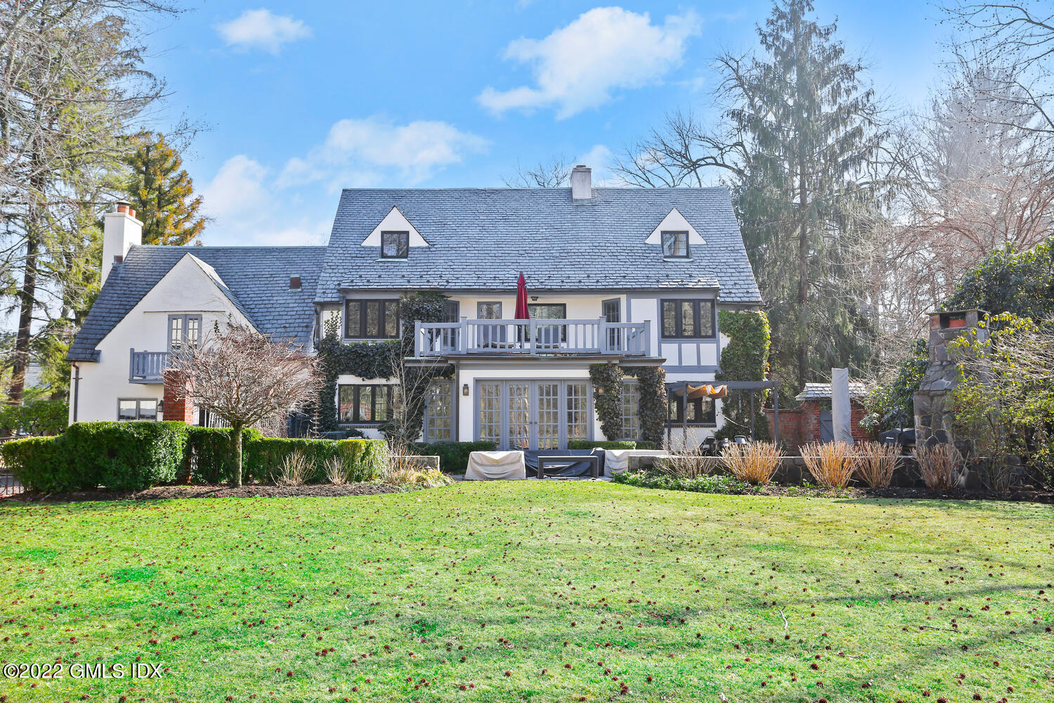 84 Meadow Road Riverside, CT 06878 - Photo 2 of 35 a front view of a house with garden