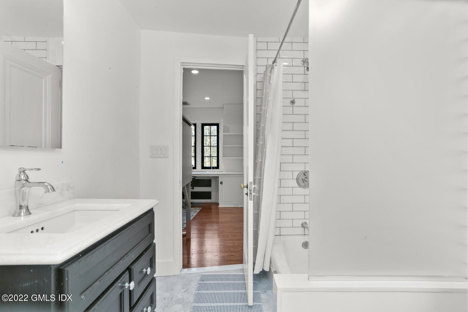 84 Meadow Road Riverside, CT 06878 - Photo 23 of 35 a bathroom with a sink and a mirror