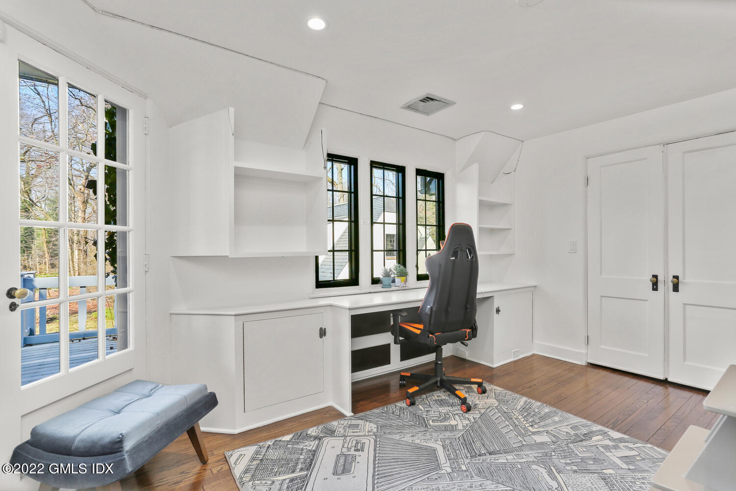 84 Meadow Road Riverside, CT 06878 - Photo 24 of 35 a view of a workspace with furniture and a window