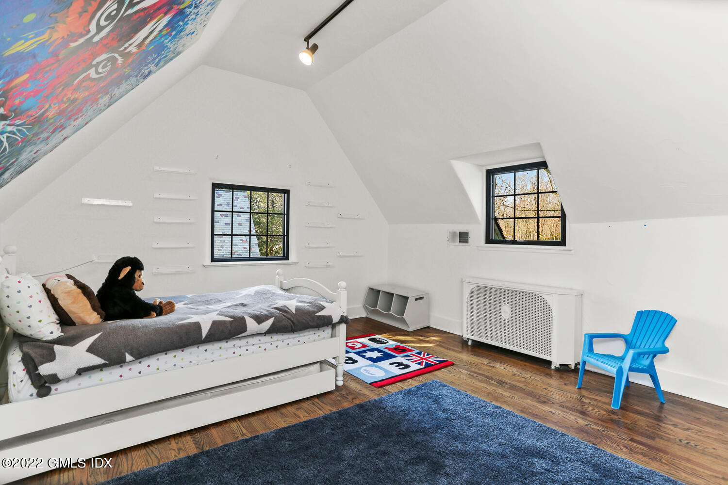 84 Meadow Road Riverside, CT 06878 - Photo 27 of 35 a bedroom with furniture and a wooden floor