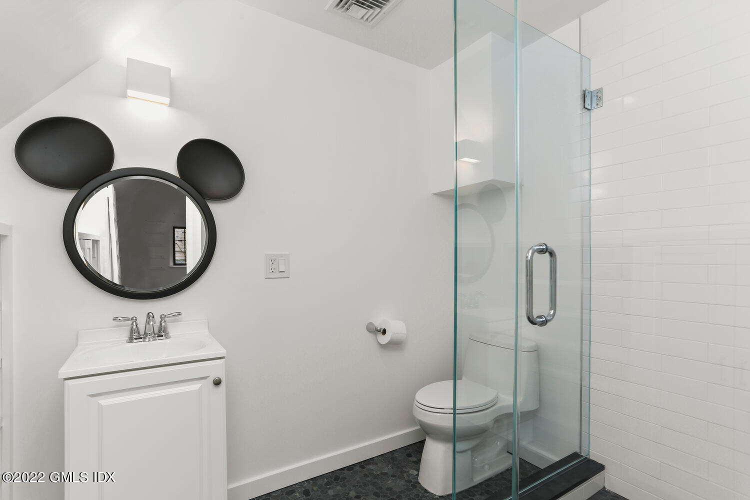 84 Meadow Road Riverside, CT 06878 - Photo 28 of 35 a bathroom with a toilet sink and mirror