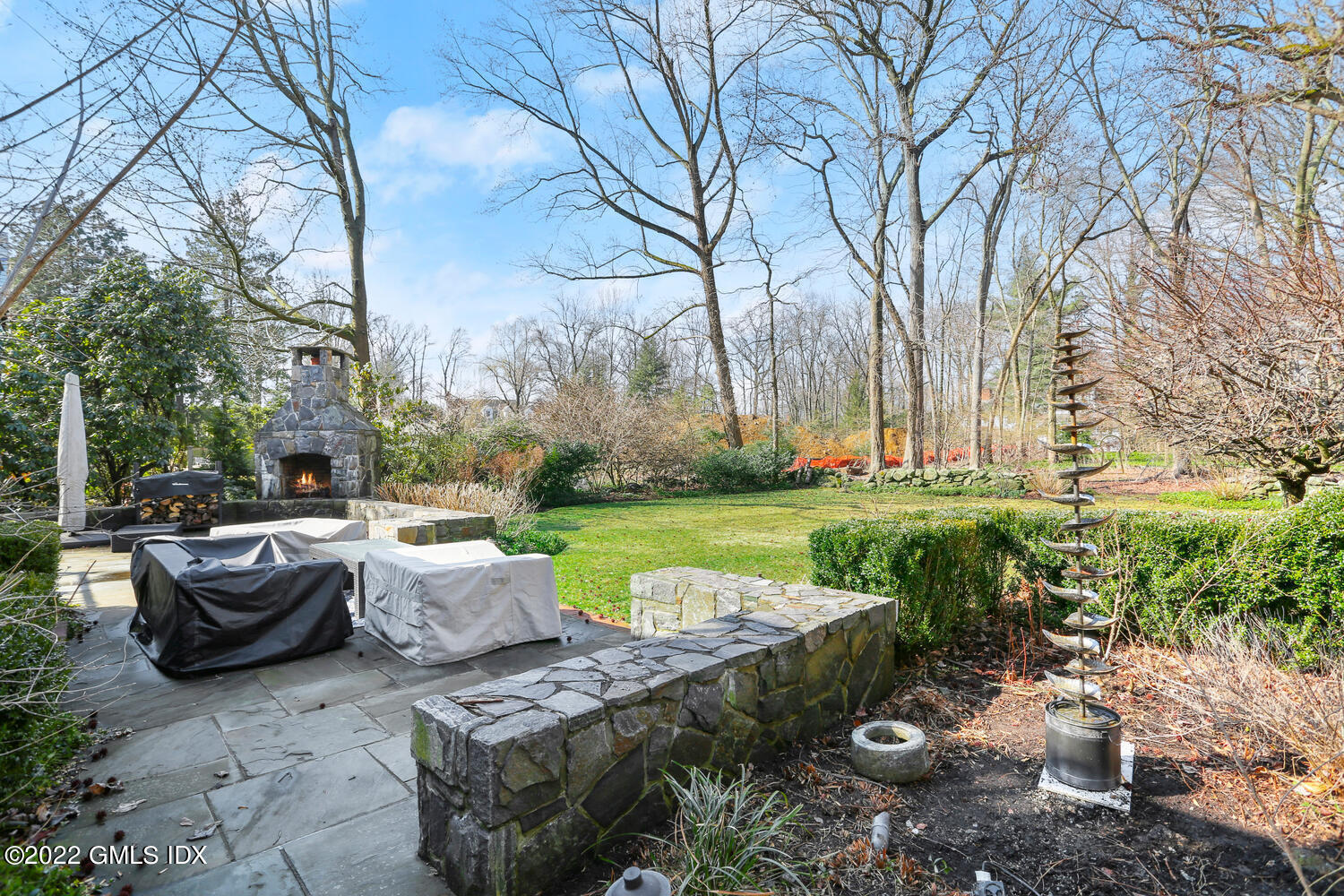 84 Meadow Road Riverside, CT 06878 - Photo 30 of 35 a view of a backyard with table and chairs potted plants and large tree