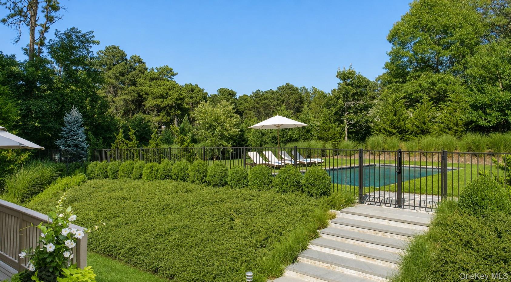 72 Hills Station Road Southampton, NY 11968 - Photo 1 of 33 a view of a garden with a lake