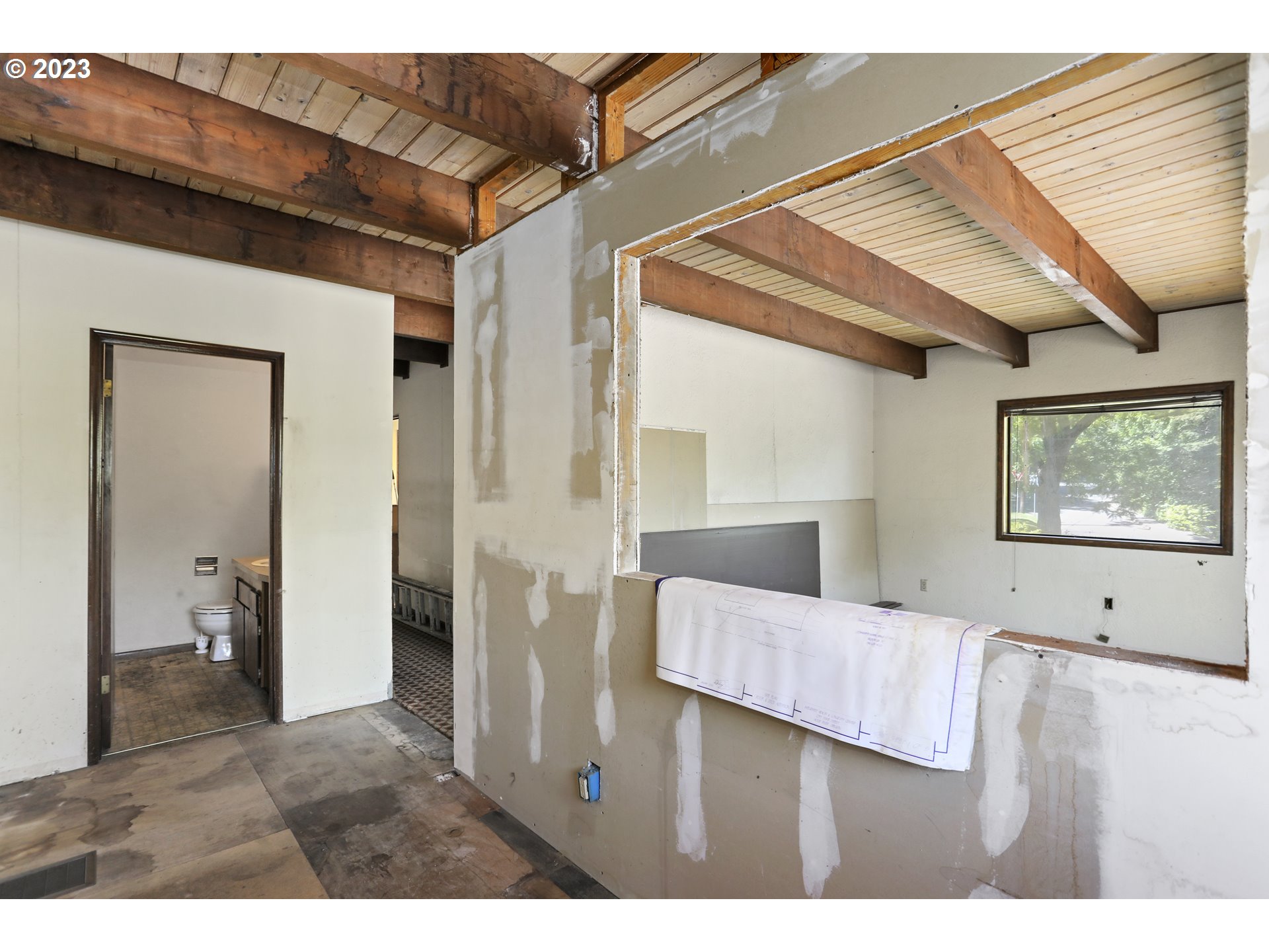 1237 State Street Hood River, OR 97031 - Photo 13 of 42 a view of a bedroom with wooden floor and bathroom