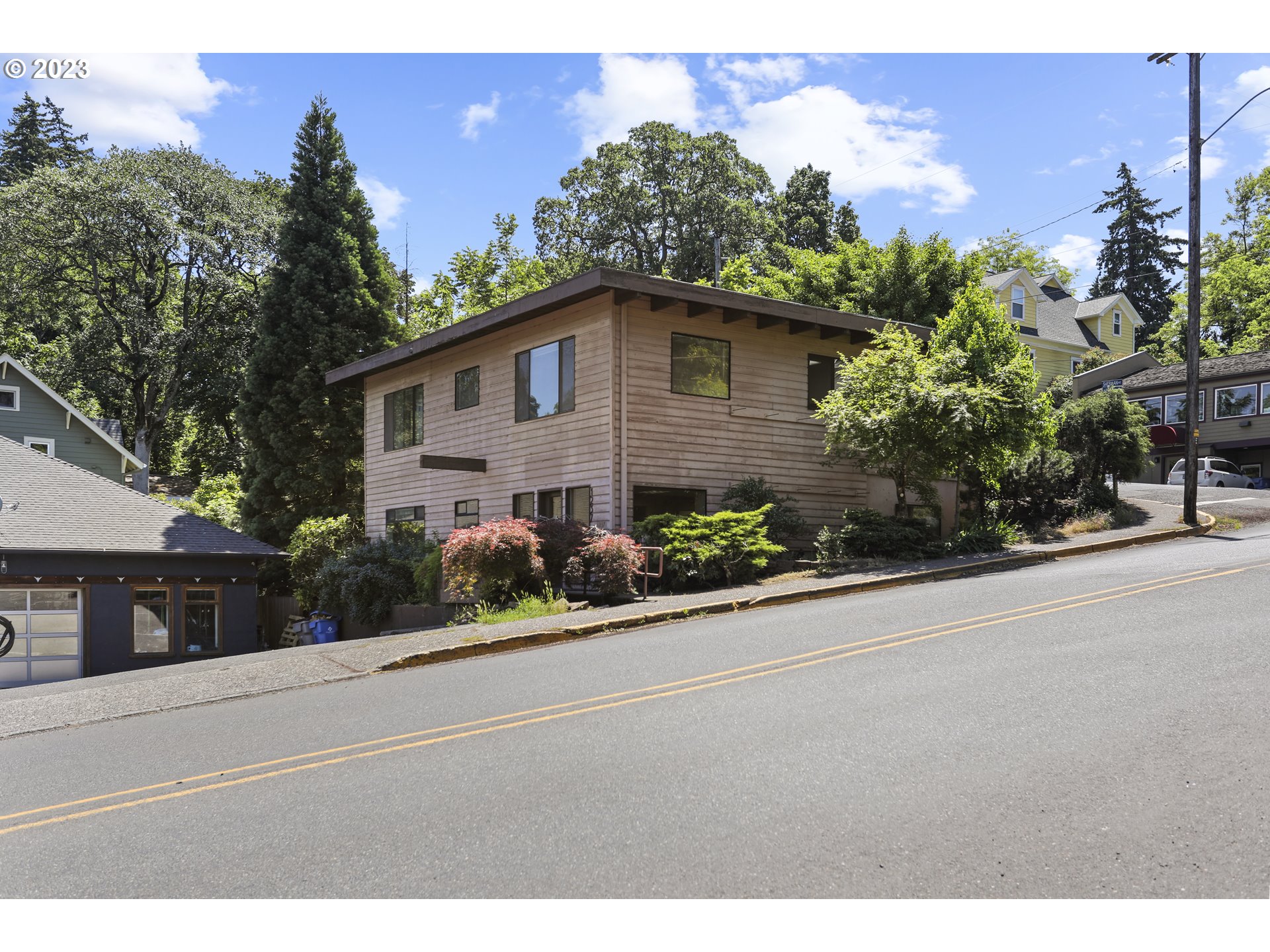 1237 State Street Hood River, OR 97031 - Photo 36 of 42 a front view of a house with a yard and garage