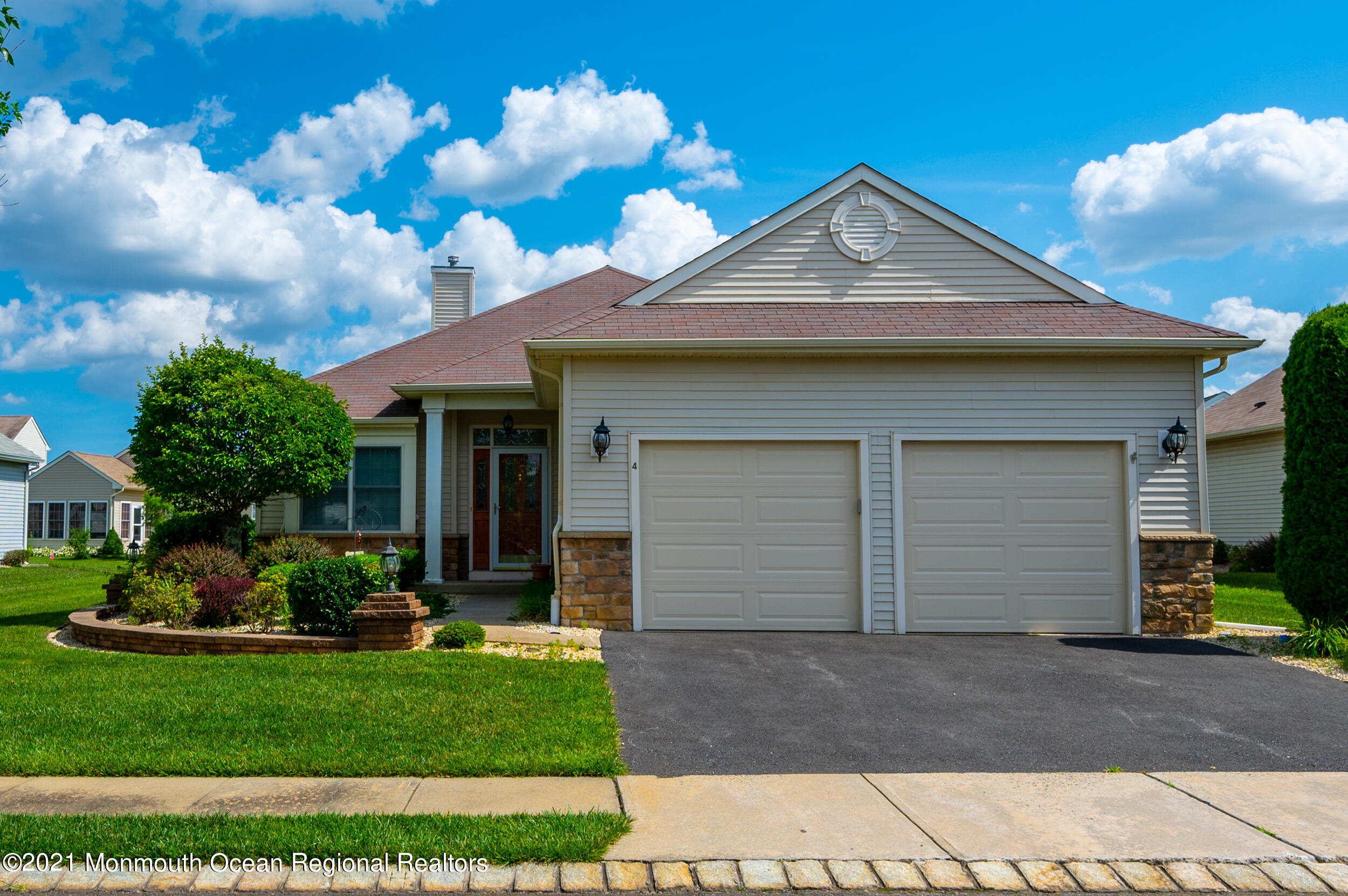 4 Chandon Road Manchester Township, NJ 08759 - Photo 1 of 38 a front view of a house with a yard and garage