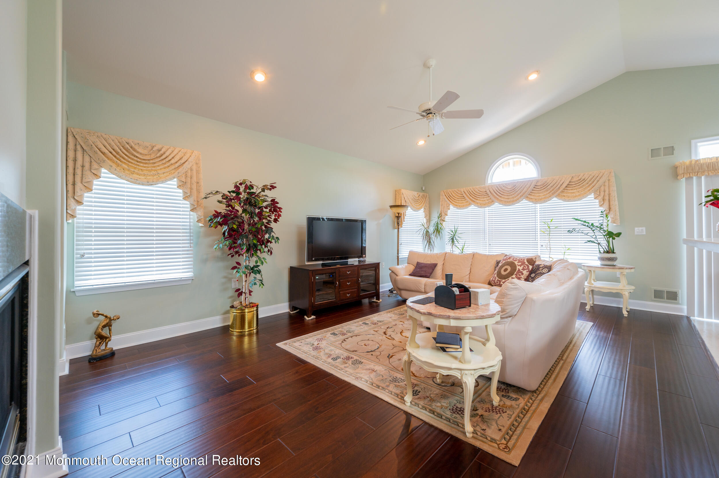 4 Chandon Road Manchester Township, NJ 08759 - Photo 11 of 38 a living room with furniture a flat screen tv and a large window