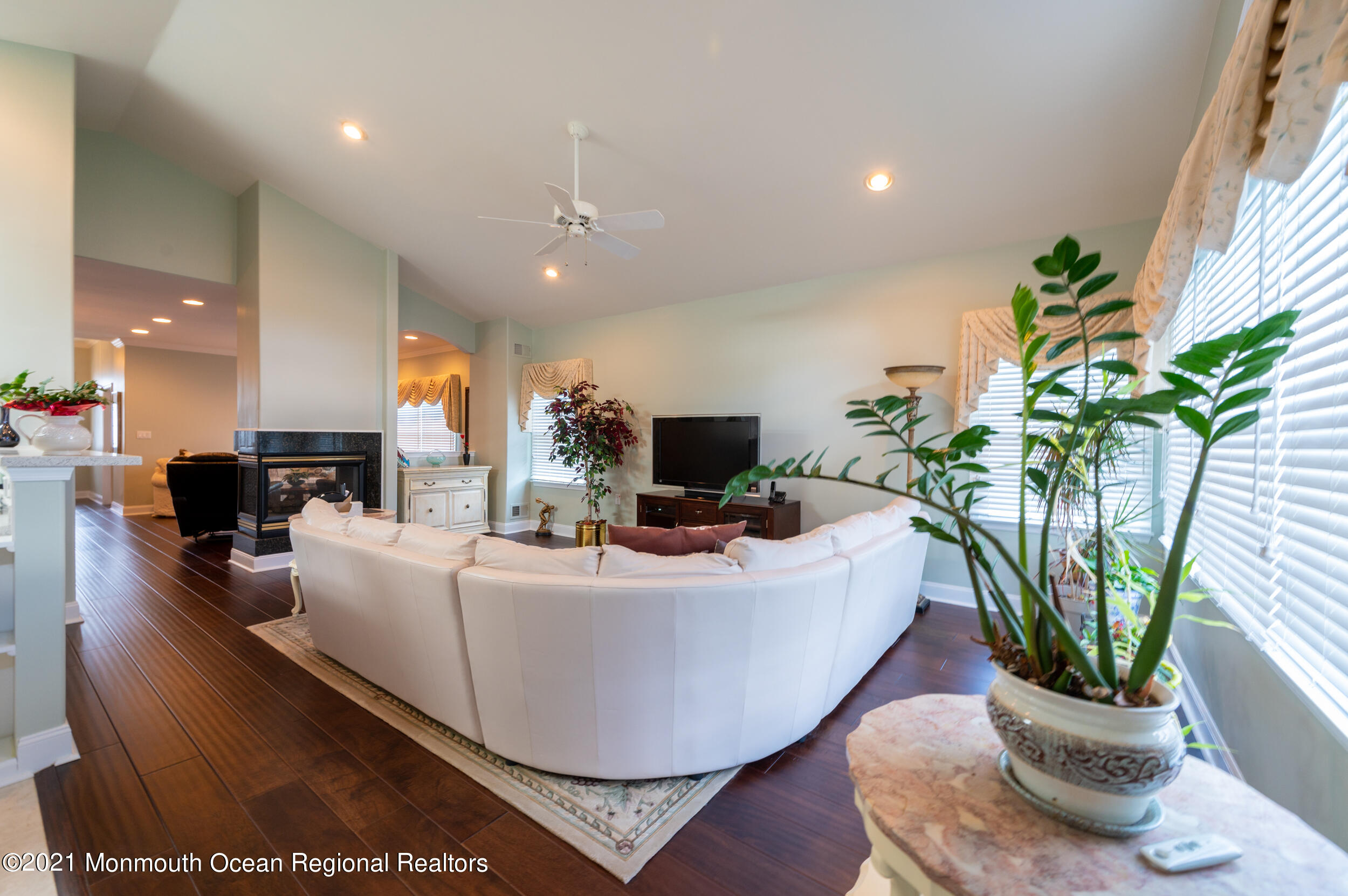 4 Chandon Road Manchester Township, NJ 08759 - Photo 15 of 38 a living room with furniture a potted plant and a fireplace