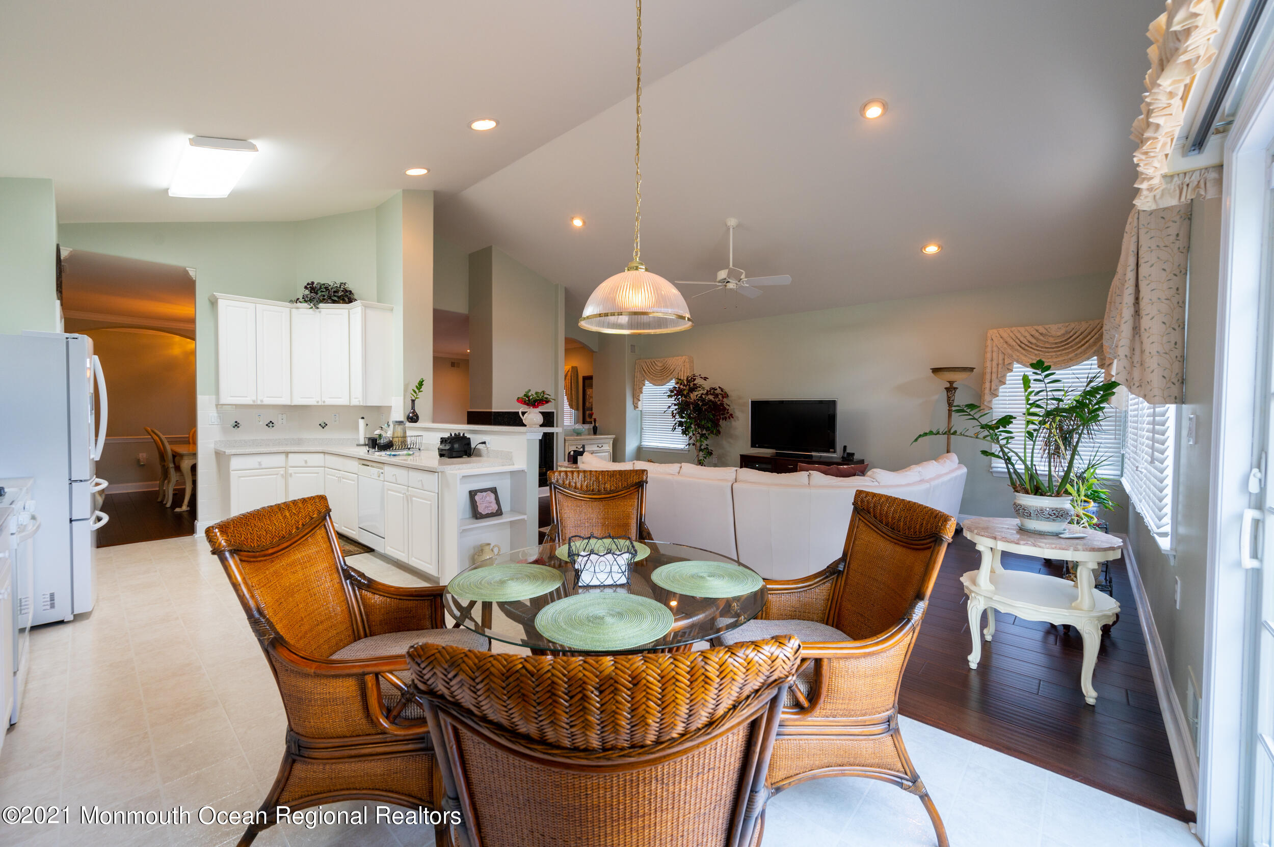 4 Chandon Road Manchester Township, NJ 08759 - Photo 17 of 38 a dining room filled chandelier and wooden floor