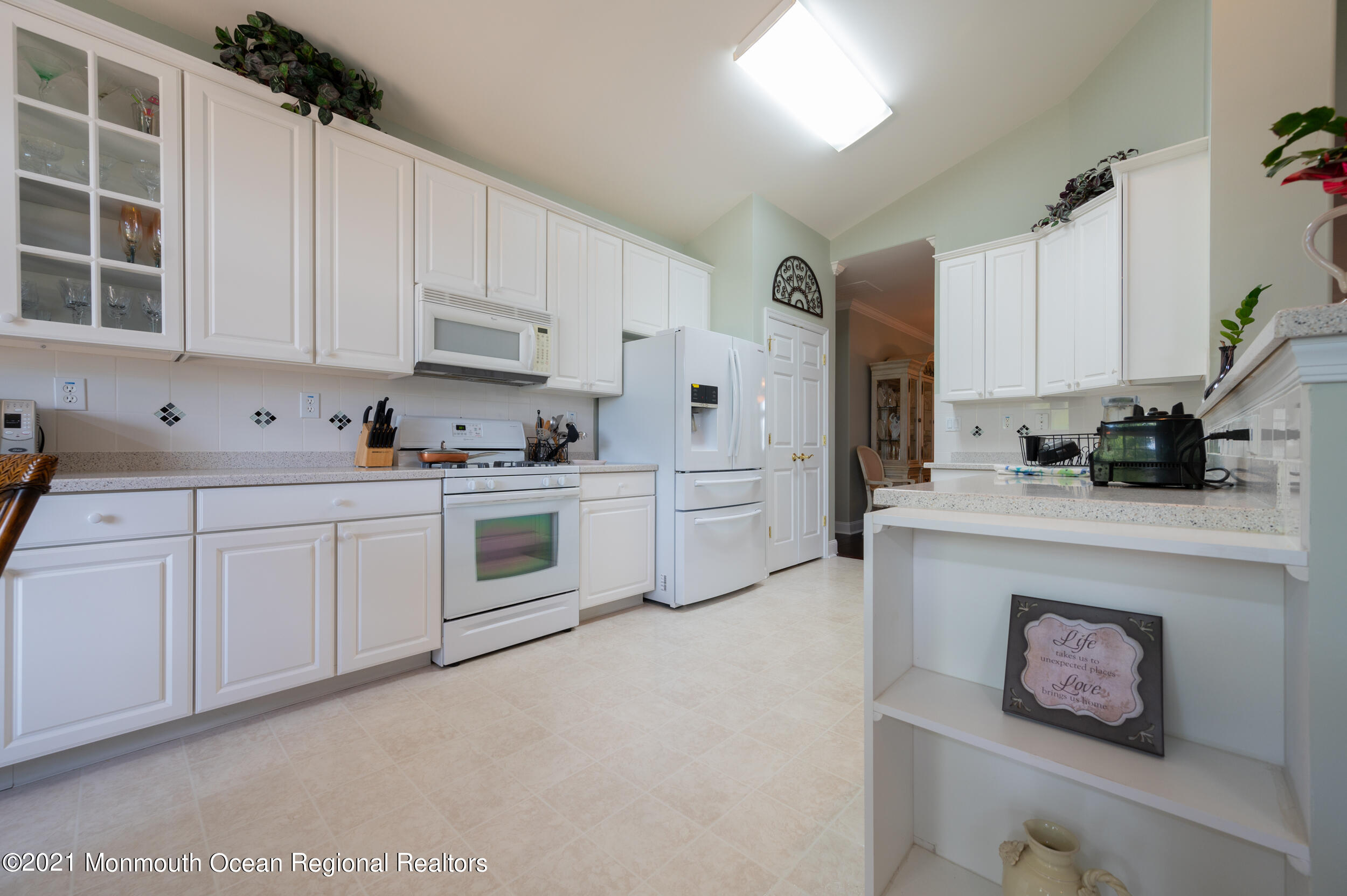 4 Chandon Road Manchester Township, NJ 08759 - Photo 18 of 38 a kitchen with cabinets appliances a sink and a counter top space