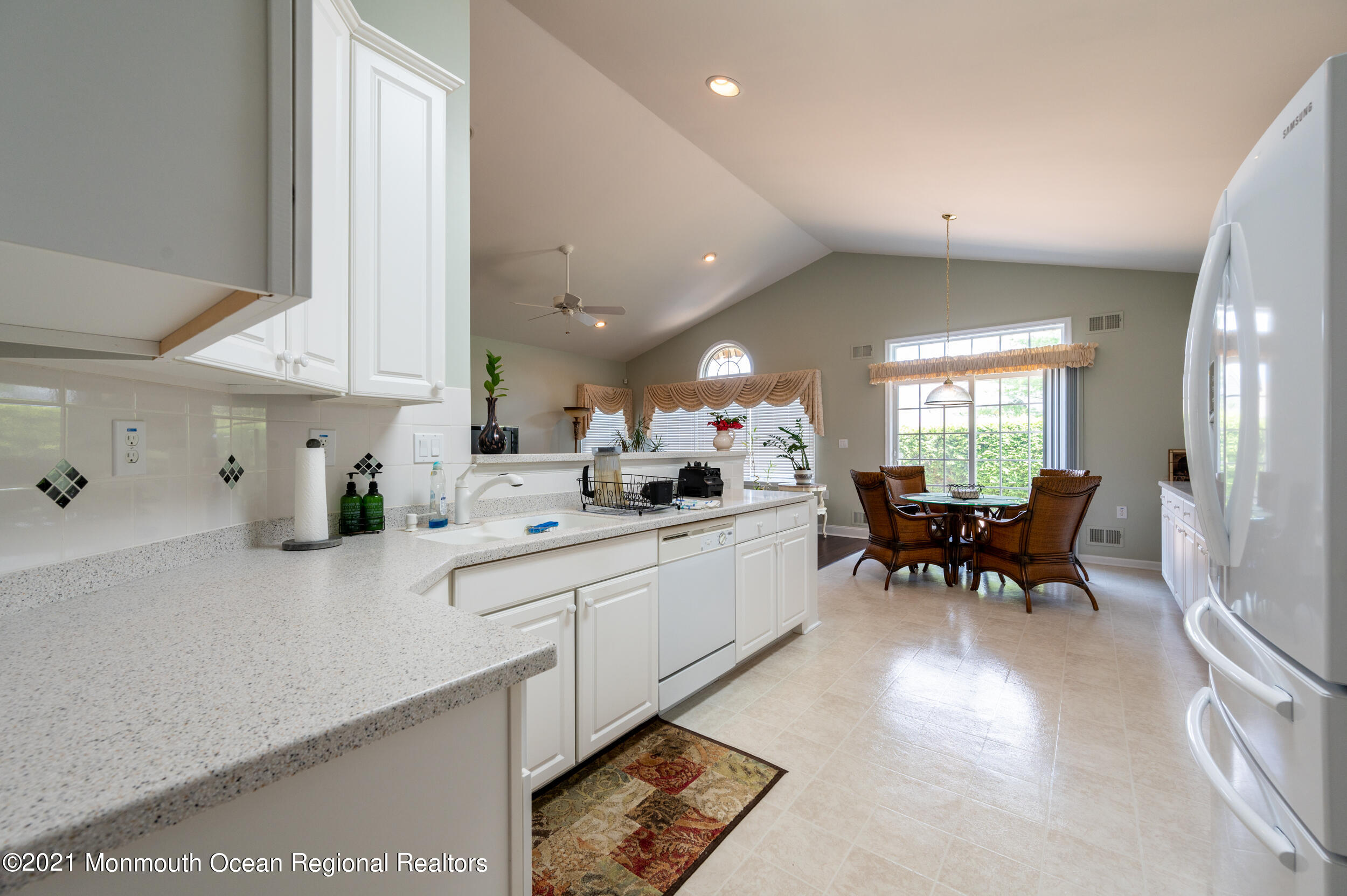 4 Chandon Road Manchester Township, NJ 08759 - Photo 19 of 38 a kitchen with counter and dining table