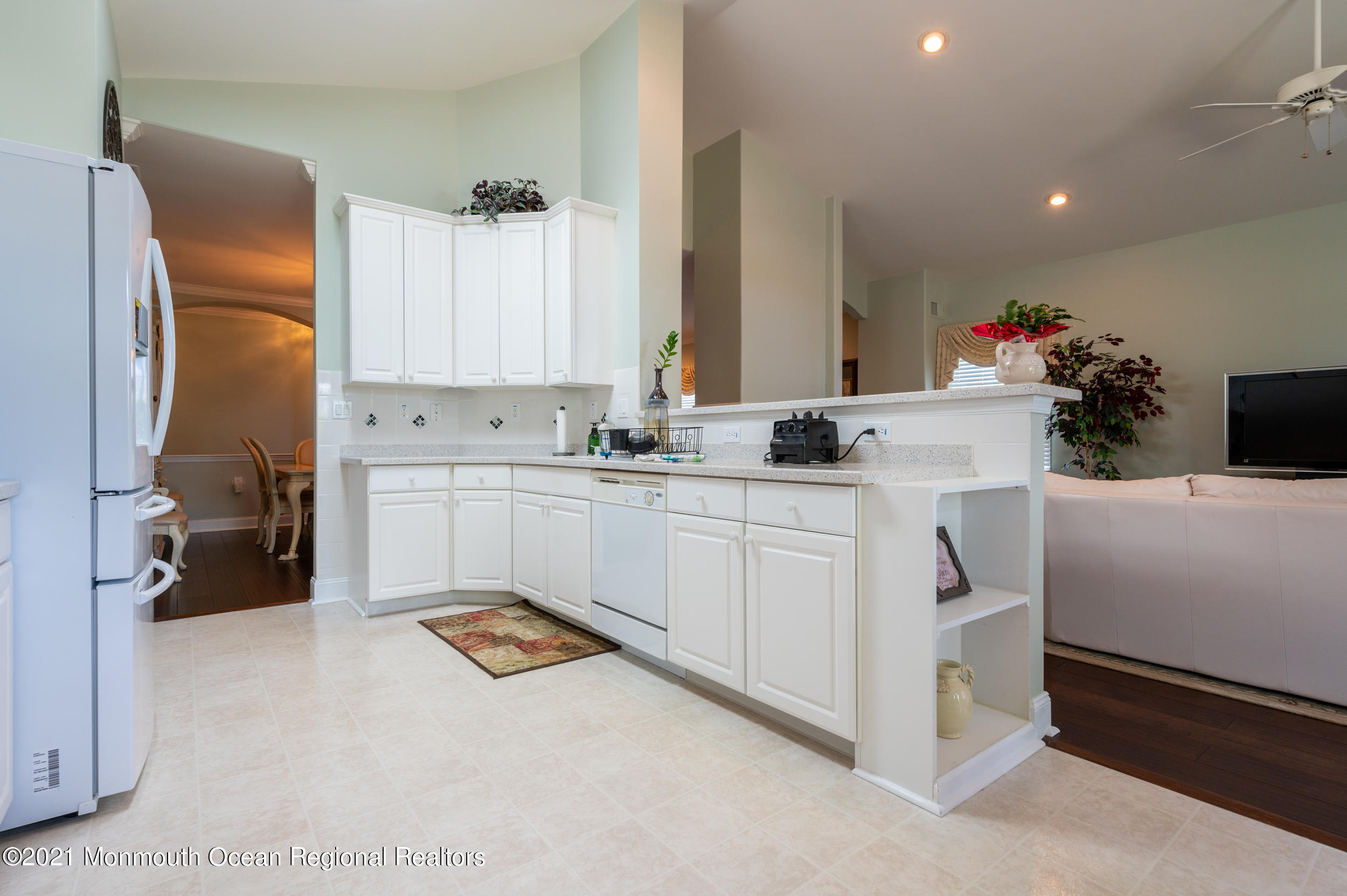 4 Chandon Road Manchester Township, NJ 08759 - Photo 20 of 38 a kitchen with sink refrigerator and cabinets