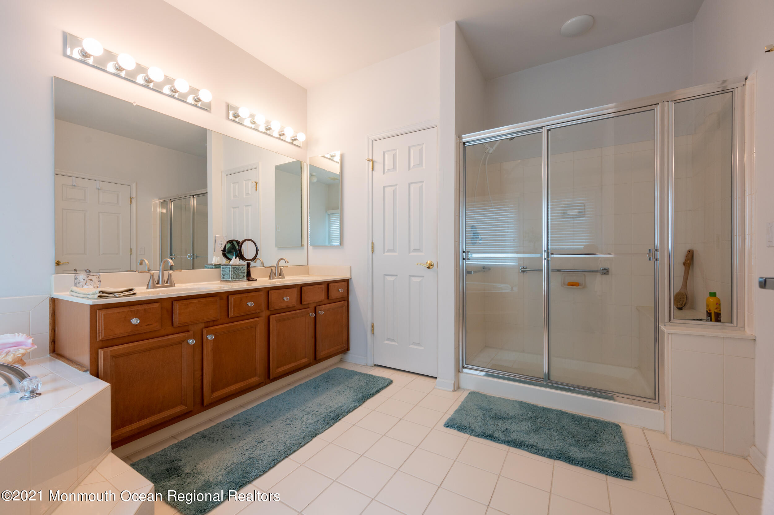 4 Chandon Road Manchester Township, NJ 08759 - Photo 24 of 38 a bathroom with a double vanity sink and mirror
