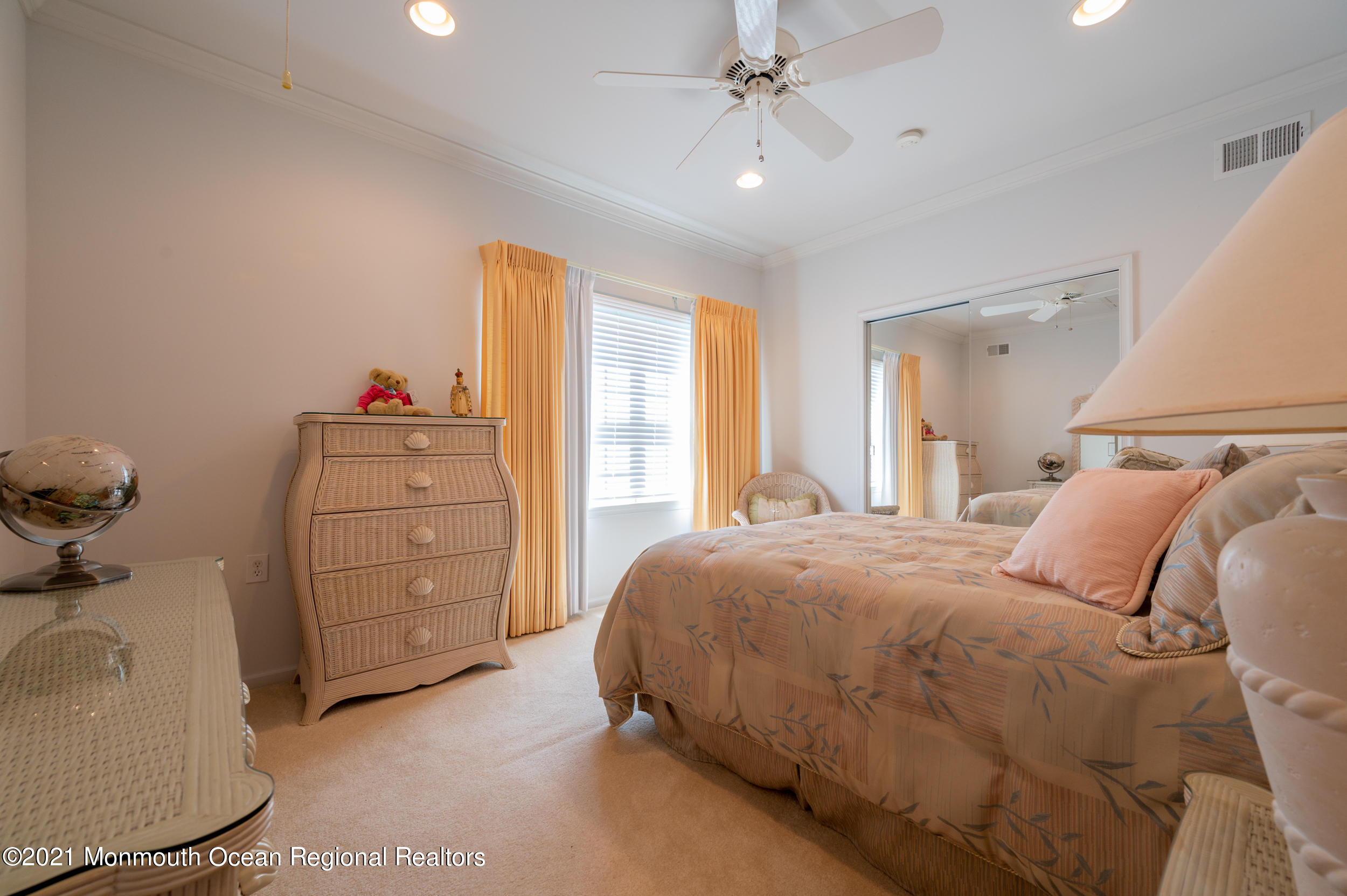 4 Chandon Road Manchester Township, NJ 08759 - Photo 25 of 38 a bedroom with a bed and a chandelier