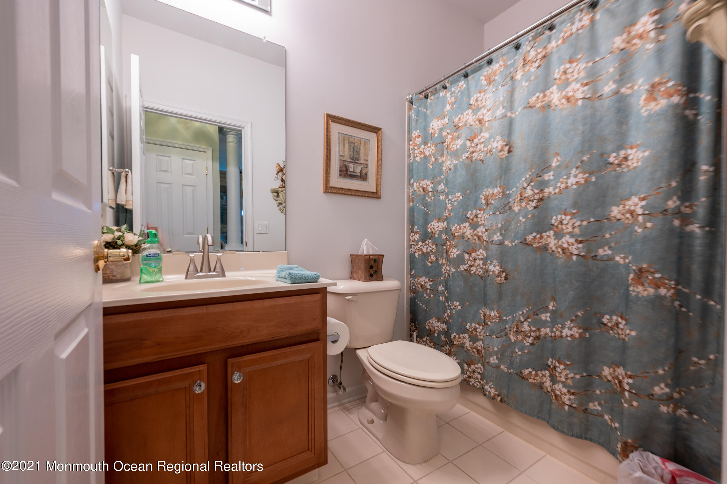 4 Chandon Road Manchester Township, NJ 08759 - Photo 26 of 38 a bathroom with a toilet sink and mirror