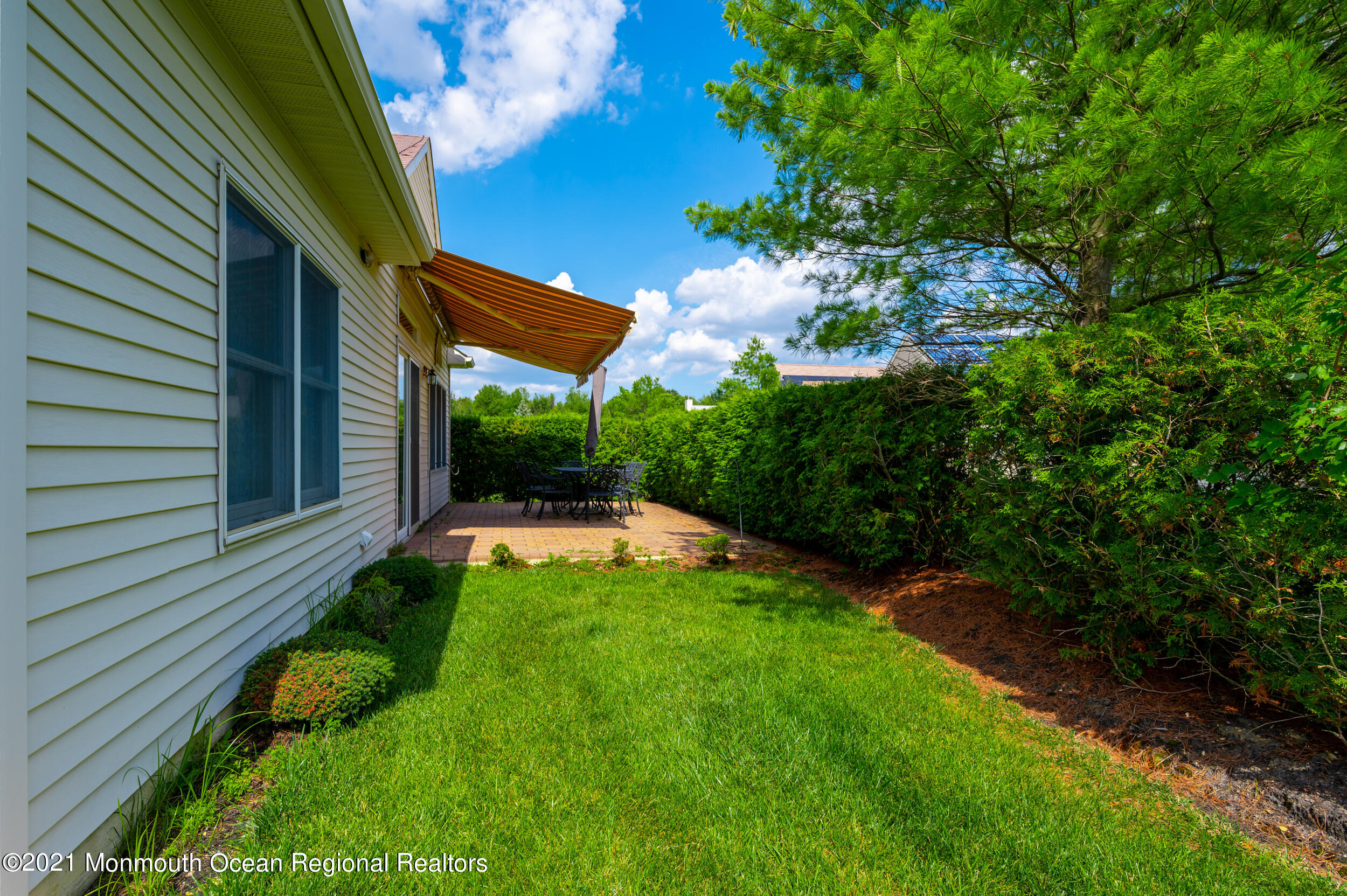 4 Chandon Road Manchester Township, NJ 08759 - Photo 31 of 38 a view of a backyard with plants and a patio
