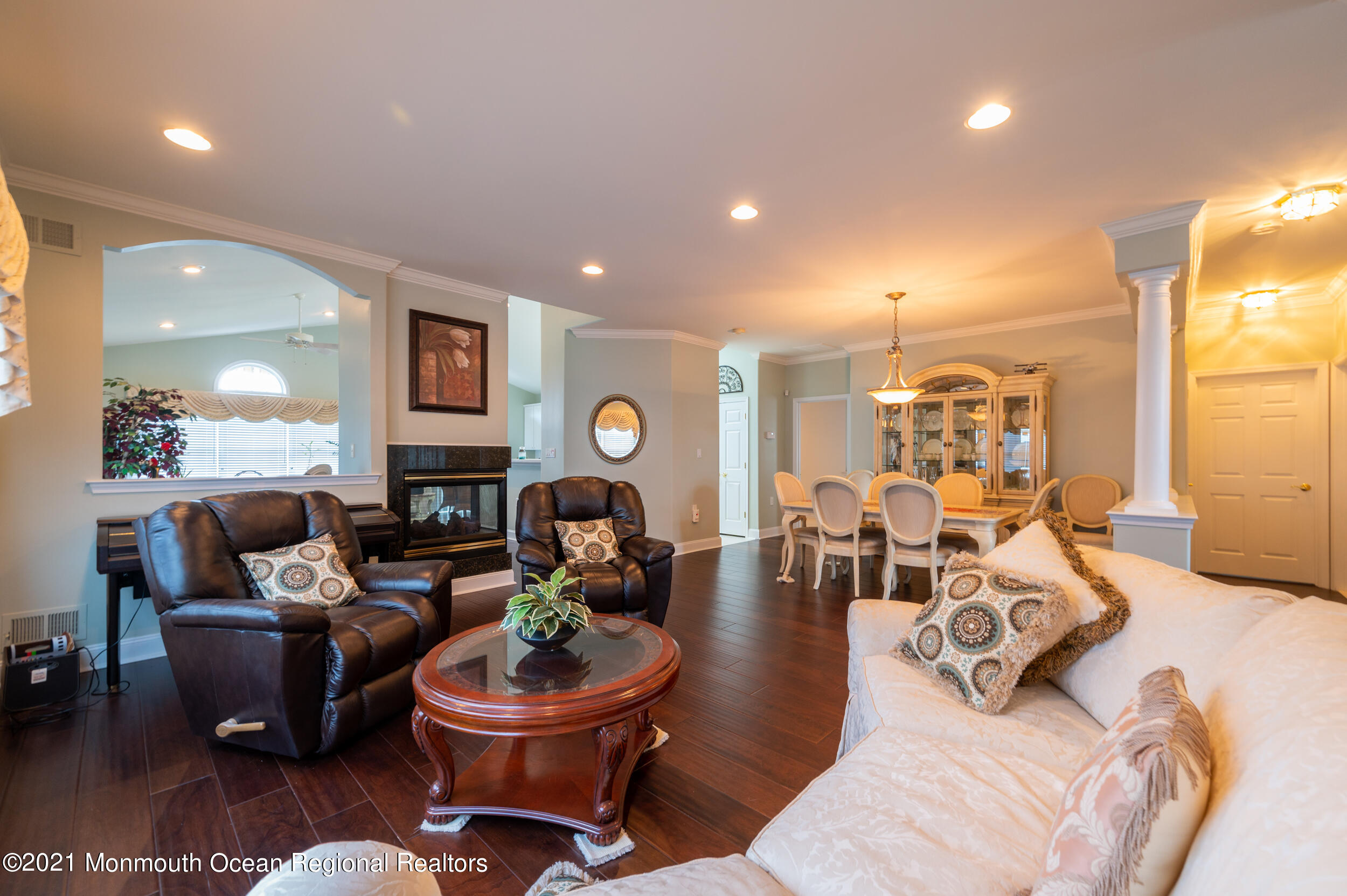 4 Chandon Road Manchester Township, NJ 08759 - Photo 6 of 38 a living room with furniture a fireplace and a window