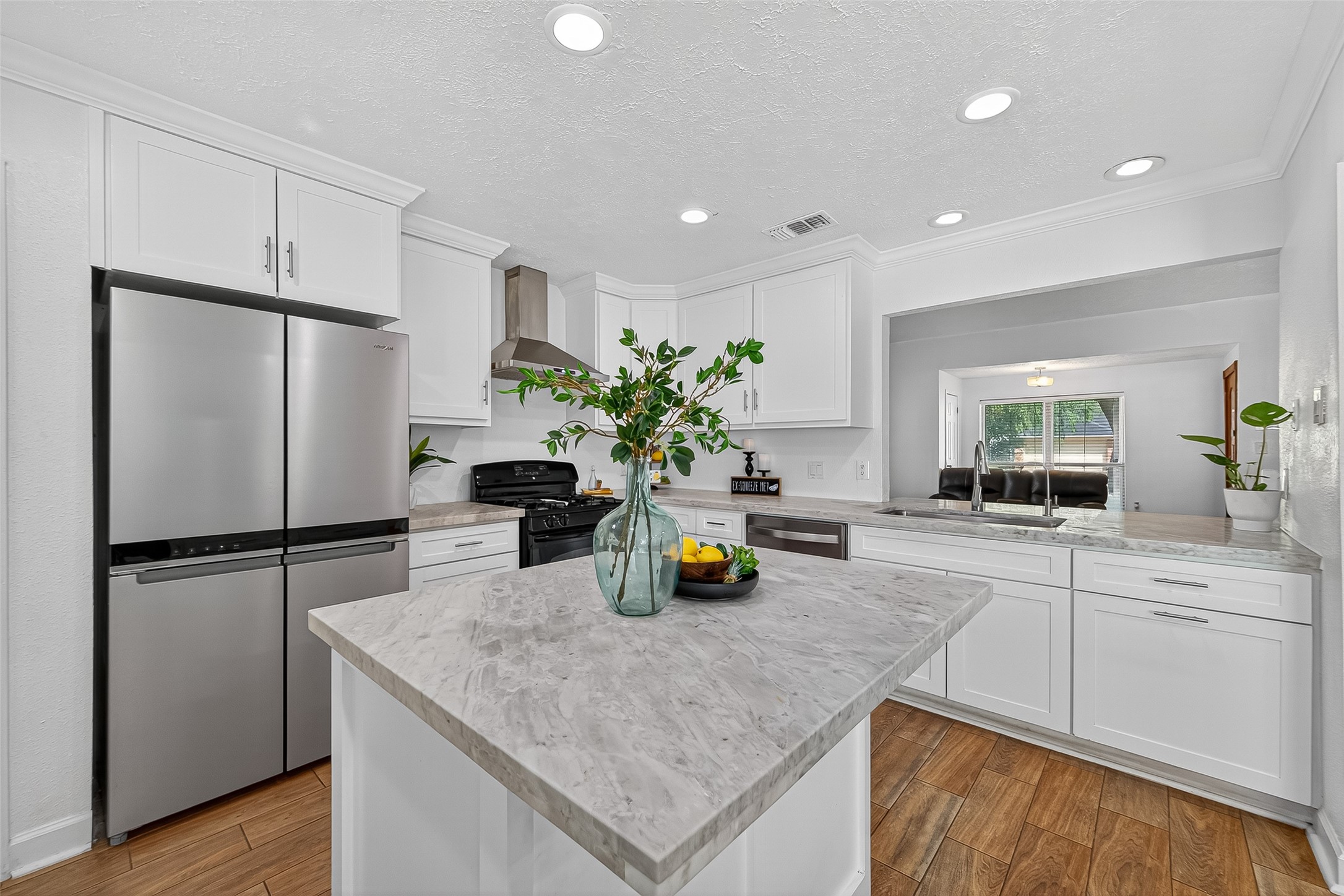 5323 Windsong Trail Houston, TX 77084 - Photo 4 of 30 An oversized island with storage and extended bar seating makes the space perfect for both meal prep and entertaining