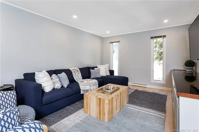 a living room with furniture and a window