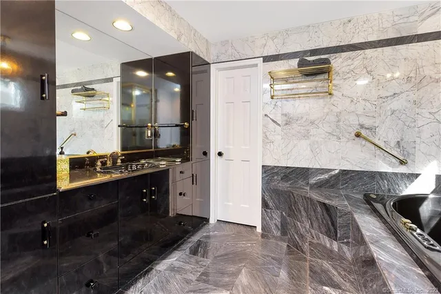 a kitchen with granite countertop a sink and cabinets