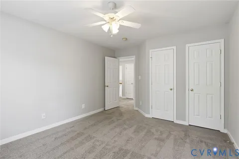 a spacious bathroom with a granite countertop sink mirror and shower