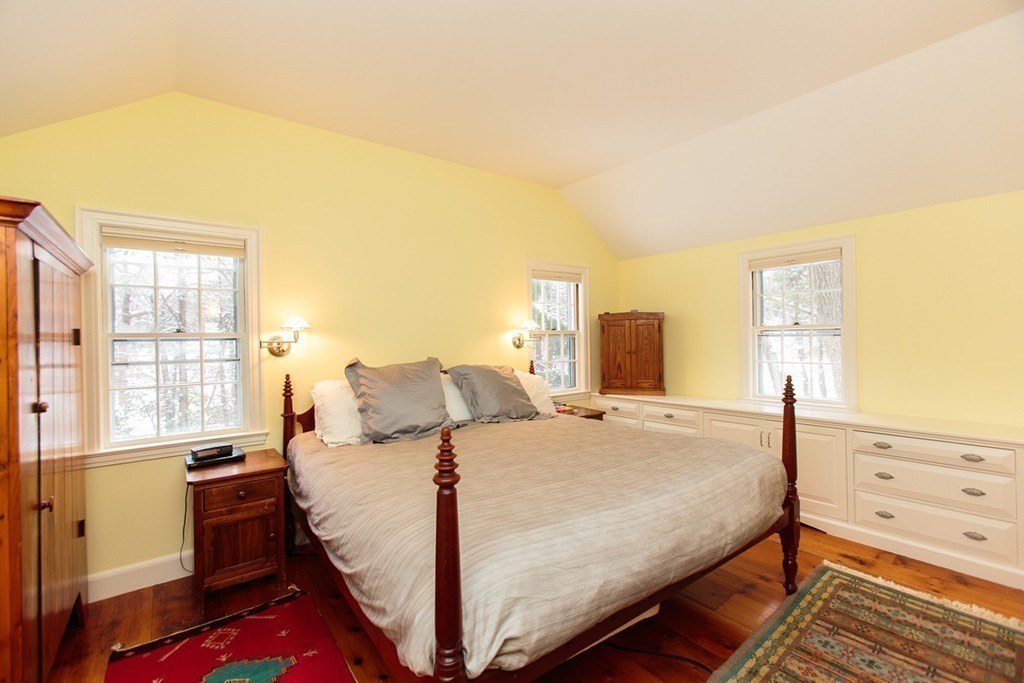 169 Ridgeway Road Weston, MA 02493 - Photo 8 of 12 a bedroom with a bed and a dresser