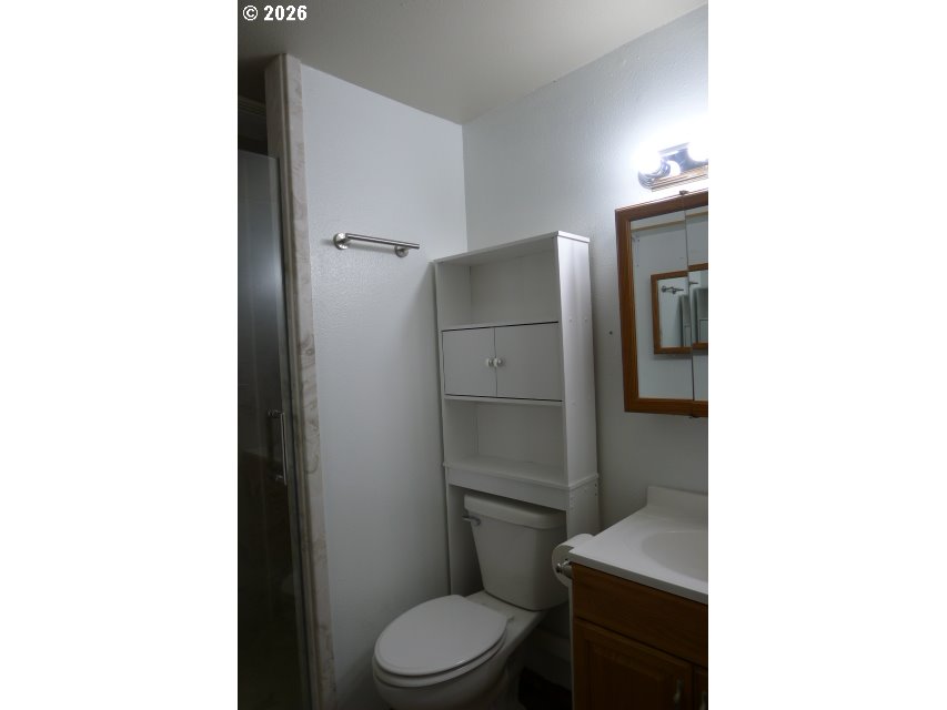 412 Camellia Court Reedsport, OR 97467 - Photo 26 of 48 a bathroom with a toilet and a shower