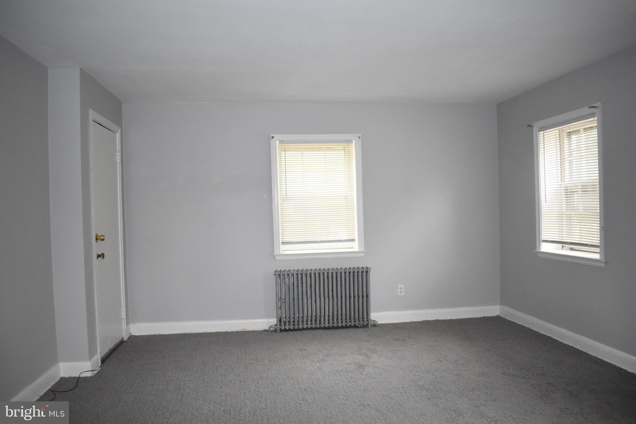 3651 Campfield Road Baltimore, MD 21207 - Photo 8 of 18 an empty room with a window