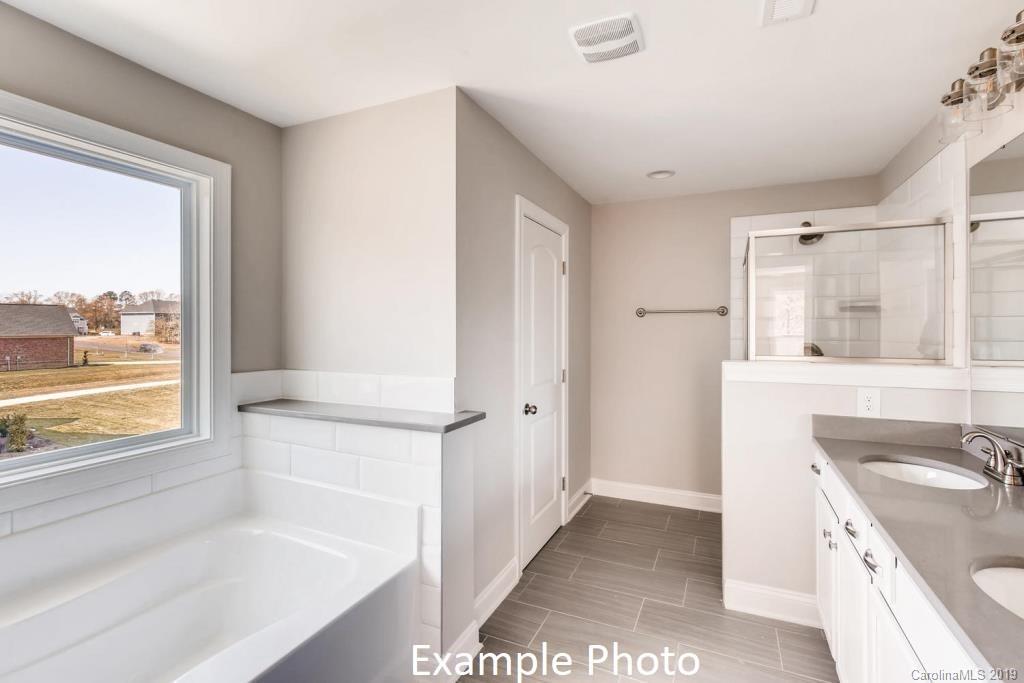 5148 Mill Creek Road, Unit 4 Clover, SC 29710 - Photo 5 of 12 a bathroom with a sink and a bathtub