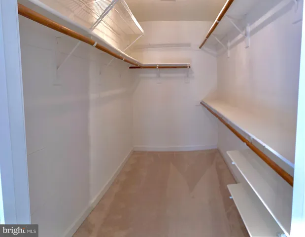 a view of an empty walk in closet