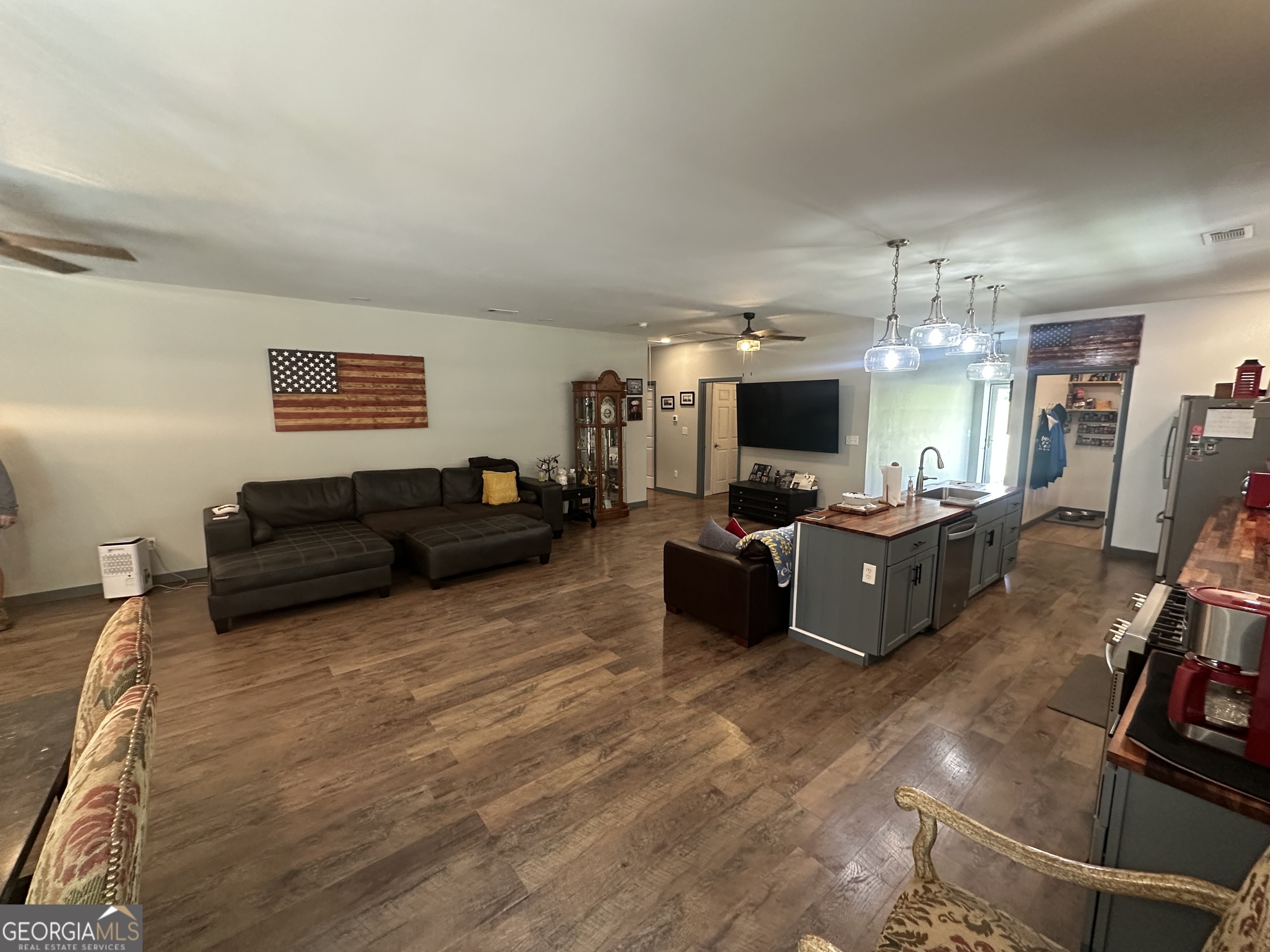 925 Cleary Road Brooklet, GA 30415 - Photo 11 of 48 a living room with furniture and a flat screen tv