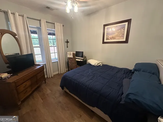 a bedroom with bed and window